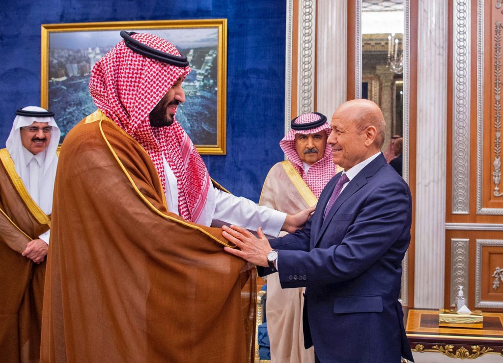 This handout image released by the Saudi press Agency (SPA) on April 7, 2022, shows Saudi Crown Prince Mohammed bin Salman shaking hands with Rashad al-Alimi, a member of Yemen's new leadership council, in Riyadh. (AFP)