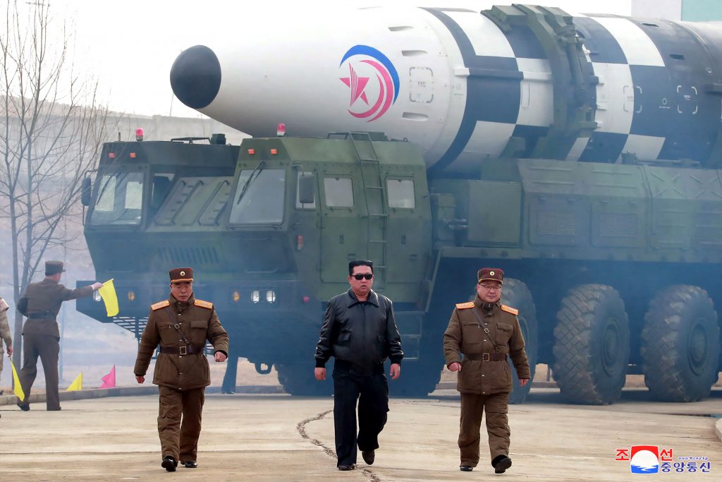 This file picture taken on March 24, 2022 and released from North Korea's official Korean Central News Agency (KCNA) on March 25, 2022 shows North Korean leader Kim Jong Un (C) walking near what a state media report says was a new type inter-continental ballistic missile (ICBM) before its test launch at an undisclosed location in North Korea. (AFP)