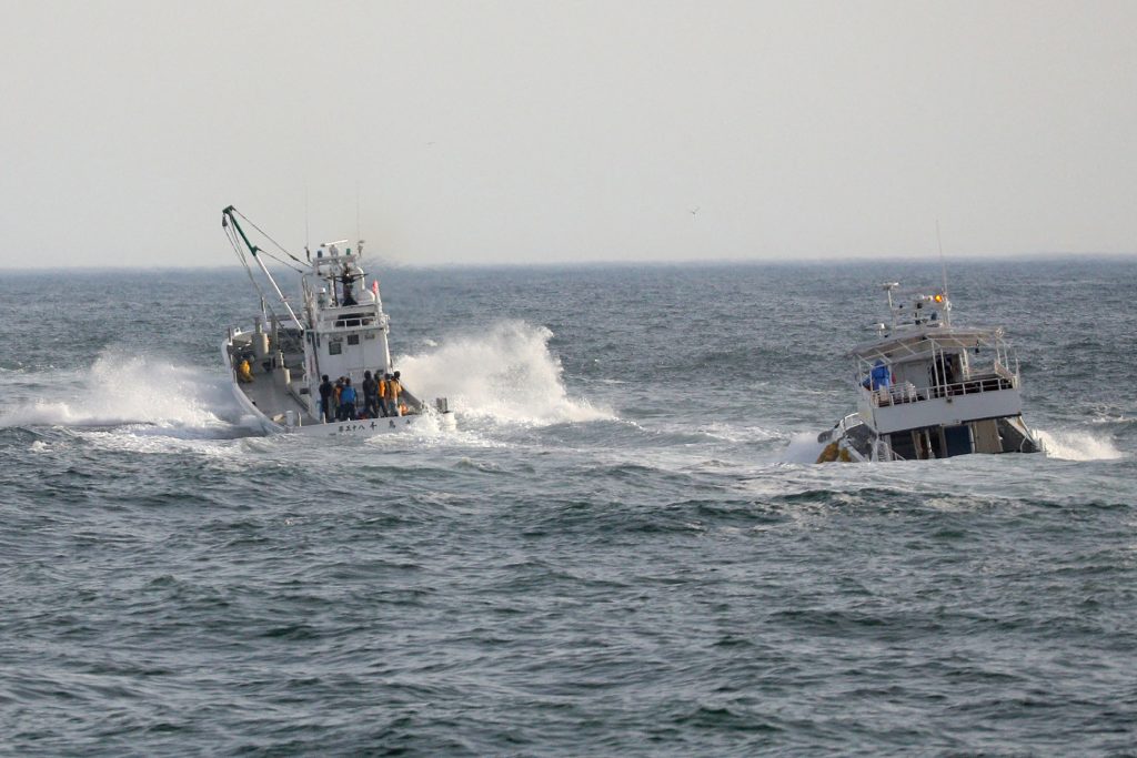 The boat sank off the Shiretoko Peninsula in Hokkaido, northernmost Japan, after leaving the town of Shari on the morning of April 23 for a sightseeing tour. Fourteen of the 26 people on board have been found and confirmed dead. (AFP)