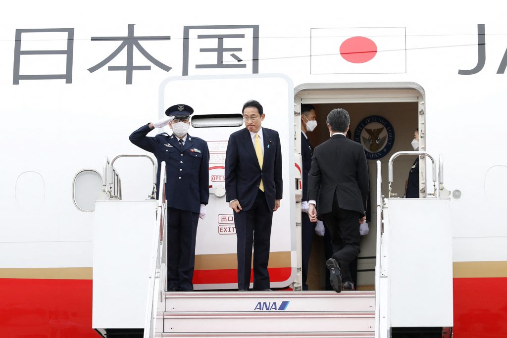 Japan's Prime Minister Fumio Kishida (C) prepares to board his flight to Indonesia at Tokyo's Haneda International Airport, April. 29, 2022. (AFP)