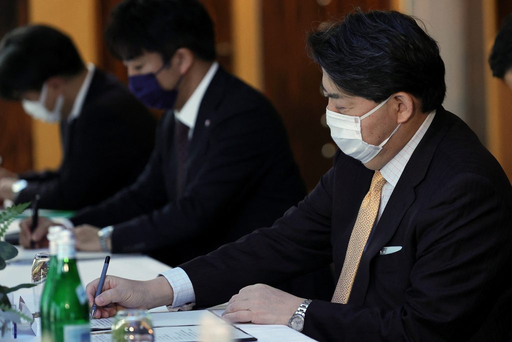 Hayashi had just returned home on Tuesday after completing a five-day trip to Poland in place of Justice Minister Yoshihisa Furukawa, who tested positive for the novel coronavirus. (AFP)