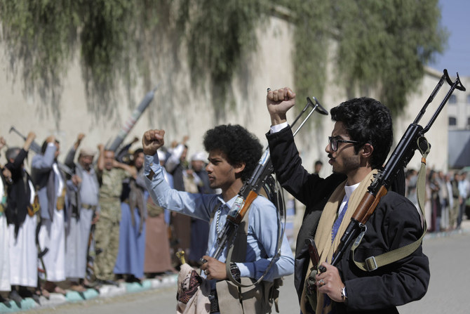 Houthis chant slogans during a gathering aimed at mobilizing more fighters for the militia in Sanaa, Yemen. (File/AFP)