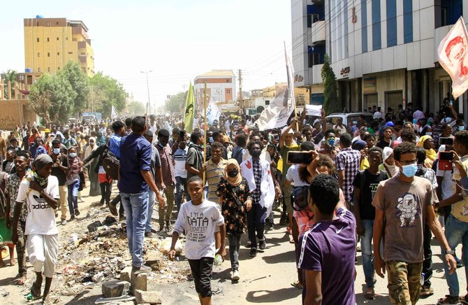 Sudanese demonstrators take to the streets of the capital Khartoum to protest last year’s military coup which deepened the country’s political and economic turmoil, on Thursday. (AFP)