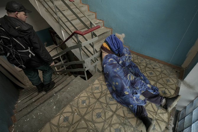 The lifeless body of a man in the staircase of a building in Bucha, Ukraine. (AP)