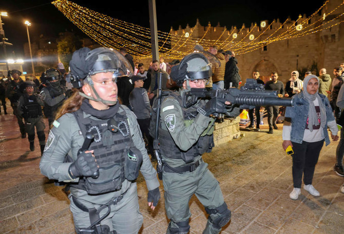 Israeli security forces gather outside the Damascus Gate in Jerusalem's Old City on April 4, 2022, during the Muslim holy month of Ramadan. (AFP)