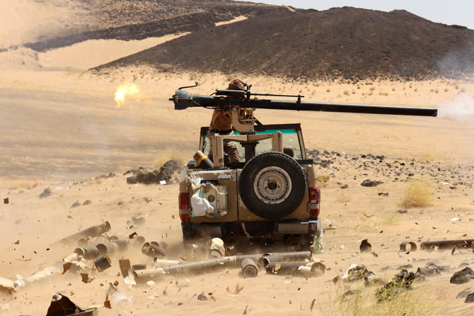 A Yemeni government fighter fires a vehicle-mounted weapon at Houthi positions, Marib, Yemen, Mar. 9, 2021. (Reuters)
