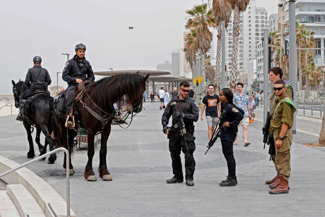 Israelis mounted police patrol the center of Israel’s Tel Aviv on April 8, 2022 a day after a Palestinian gunman killed two Israeli men and wounded several others. (AFP)