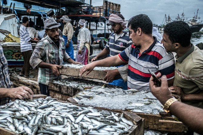 A worker vends freshly-caught fish at a pier in the Egyptian town of Ezbet al-Borg along the Nile river delta's Damietta branch. (AFP file)