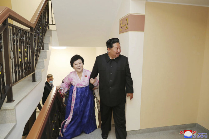 Kim Jong Un, right, visits the new house of Korean Central Broadcasting announcer Ri Chun-Hee at the Pothong riverside terraced residential district in Pyongyang on April 13, 2022. (KCNA/KNS via AP)