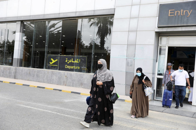 Travellers walk out of Sanaa airport upon their arrival in Sanaa, Yemen April 24, 2022. (REUTERS)