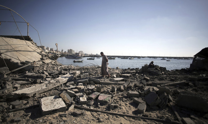 A Palestinian man inspects the damage at a police post following an Israeli missile strike that killed four boys from the same extended Bakr family, in Gaza City, July 16, 2014. (AP)