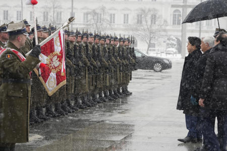 Japan's Foreign Minister Yoshimasa Hayashi, third from right, reviews the honor guard as he attends a wreath-laying ceremony at the Tomb to the Unknown Soldier in Warsaw, Poland, Saturday, April 2, 2022. (AP)