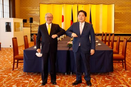 Japan's Foreign Minister Yoshimasa Hayashi (right) and Philippine Foreign Secretary Teodoro Locsin (left) pose before a meeting at the Iikura Guest House in Tokyo on April 9, 2022. (AFP)