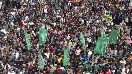 This aerial view shows supporters of the Palestinian Hamas movement rallying after Friday prayers, in Jabalia in the northern Gaza Strip, to show solidarity with Palestinians confronting Israeli forces at the Al-Aqsa Mosque compound in Jerusalem, on April 22, 2022. (AFP)
