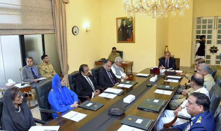 In this photo released by Press Information Department, Pakistan's Prime Minister Shahbaz Sharif, center, chairs the National Security Committee meeting, in Islamabad, Pakistan, Friday, April 22, 2022. (Press Information Department via AP)