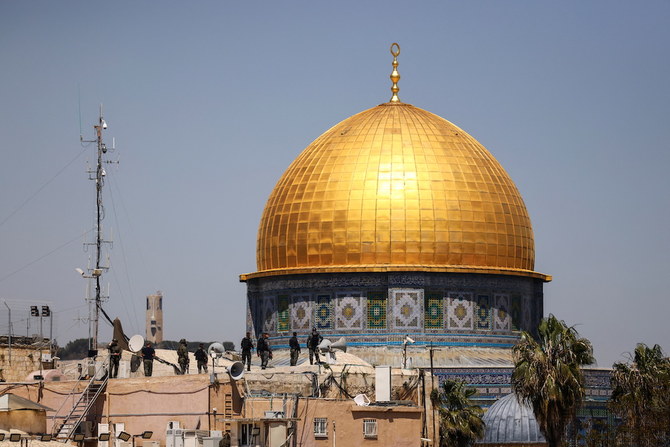 Israeli security forces stand on a roof top near the compound that houses Al-Aqsa Mosque, following clashes in Jerusalem’s Old City April 15, 2022. (Reuters)
