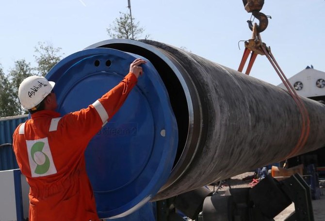 A worker puts a cap to a pipe at the construction site of the Nord Stream 2 gas pipeline, near the town of Kingisepp, Leningrad region, Russia, June 5, 2019. (Reuters)