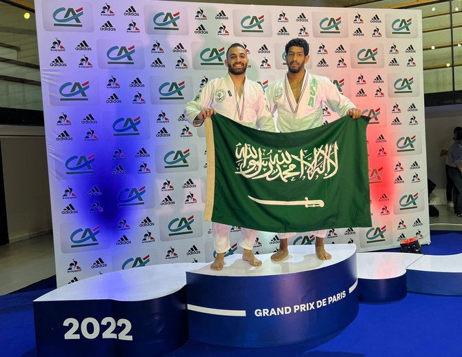Saudi's Abdulmalik Al-Murdhi (right) and Faris Kashmeeri celebrate their respective gold and silver medals in Paris. (Saudi JJF)