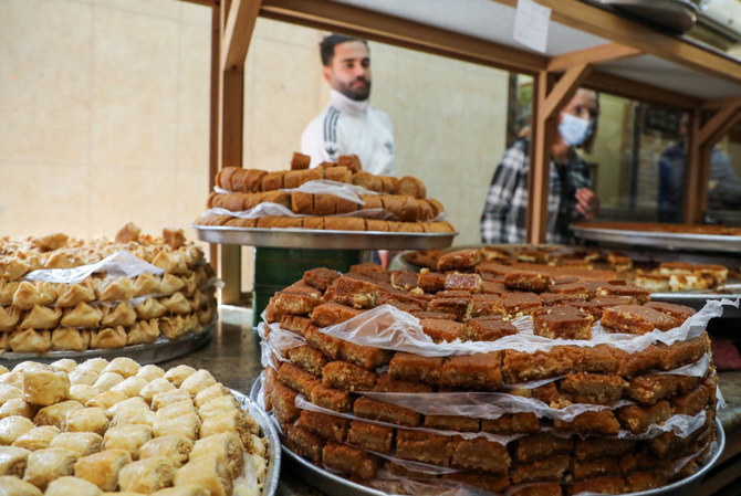 People buy sweets ahead of the holy fasting month of Ramadan in Beirut, Lebanon on Tuesday. (Reuters)