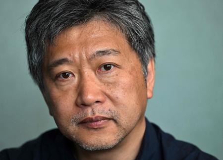 Japanese film director Hirokazu Kore-Eda poses during a portrait session, on the sidelines of the 75th edition of the Cannes Film Festival in Cannes, southern France, on May 26, 2022. (AFP)