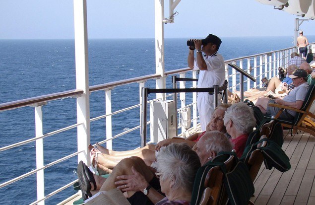 A lookout aboard the Queen Mary 2 scans the horizon for pirates in the Southern Red Sea, Jan. 24, 2013. (Reuters)