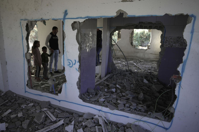 Palestinians check demolished home in the West Bank village of Silat al-Harithiya, near Jenin, Saturday, May 7, 2022. (AP Photo/Majdi Mohammed)