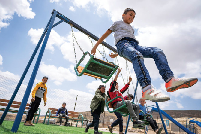 Palestinian children play at an entertainment facility in the West Bank Bedouin community of Jinba. (AP)