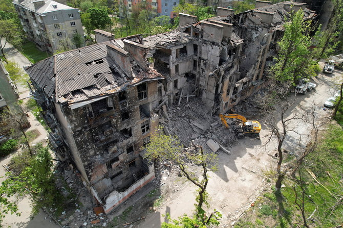 Emergency management specialists remove debris of a building destroyed during Ukraine-Russia conflict in Mariupol, Ukraine May 11, 2022. (Reuters)