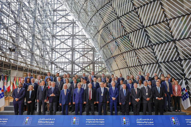 Dignitaries at the Supporting the future of Syria and the region meeting pose for a group photo at the European Council building in Brussels. (AP)