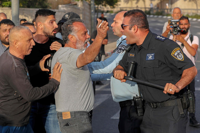 Palestinians clash with Israeli security forces during a protest condemning the death of Al-Jazeera journalist Shireen Abu Akleh in east Jerusalem on May 11, 2022. (Ahmad Garabili / AFP)