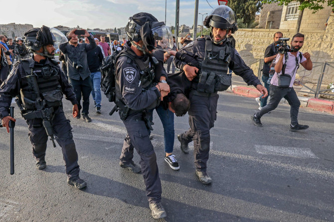 Israeli security forces detain a Palestinian during a protest condemning the death of journalist Shireen Abu Akleh in Ieast Jerusalem on May 11, 2022. (Ahmad Garabili / AFP)