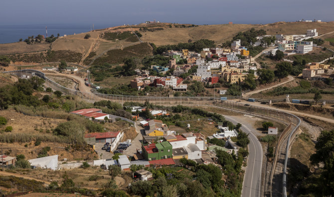 View of the border fence that separates Spain, left, and Morocco, right, as seen from the Spanish enclave of Ceuta, Thursday, June 3, 2021. (AP/File)