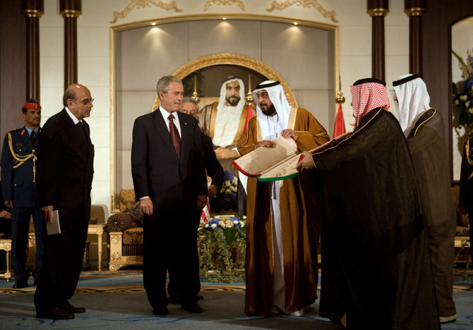 Sheikh Khalifa presents a sash to US President George W. Bush Jan. 13, 2008 at the Al Mushref palace in Abu Dhabi. (AFP)