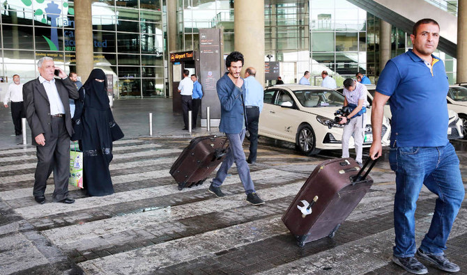 Yemeni passengers leave the Queen Alia Airport following their arrival to the Jordanian capital Amman on May 16, 2022. (AFP)