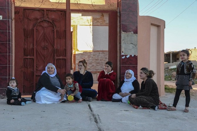 Above, a Yazidi family in the northern Iraqi town of Sinjar. The Yazidis are a Kurdish-speaking minority who were persecuted by Daesh for their non-Muslim faith. (AFP)