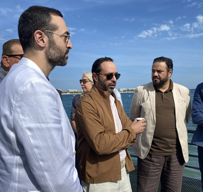 Saudi Deputy Minister of Culture Hamed bin Mohammed Fayez (center), Film Commission CEO Abdullah Al-Eyaf (right) and Red Sea Film Festival CEO Mohammed Al-Turki (left) at Cannes. (Arab News)