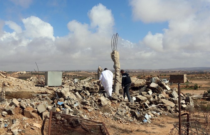 Above, debris of a destroyed building in the town of Al-Goualiche west of the Libyan capital Tripoli. (AFP)