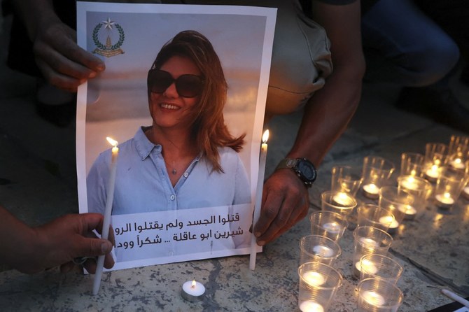 Family and friends of Al Jazeera reporter Shireen Abu Akleh attend a candle vigil outside the Church of the Nativity in Bethlehem. (File/AFP)