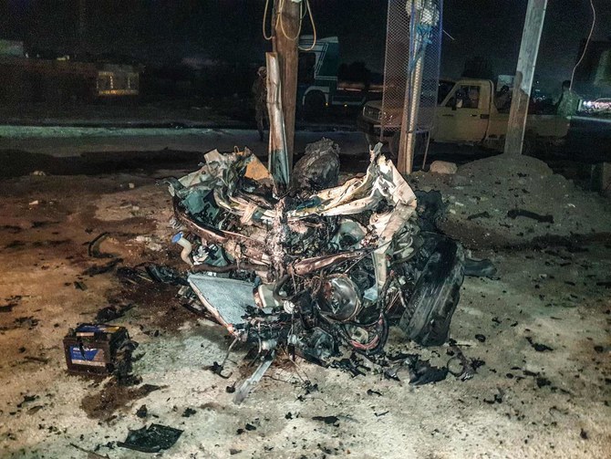 A damaged car in an area where a bomb attack happened in Aden in March. Police said Thursday 4 people were killed and over 30 injured at a Yemen fish market when an explosive device in a trash can detonated. (AFP)
