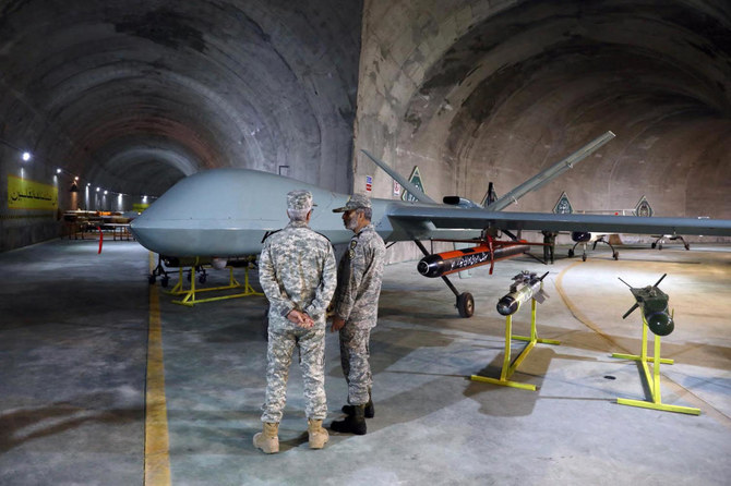 Commander-in-Chief of the Iranian Army Major General Abdolrahim Mousavi, right, and Armed Forces Chief of Staff Major General Mohammad Bagheri visit the unnamed underground drone base. (Iranian Army/AFP)