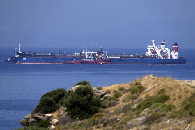 The Pegas tanker, that has recently changed its name to Lana, foreground, is seen off the port of Karystos on the Aegean Sea island of Evia, Greece on Friday. (AP)