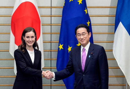 Finland's Prime Minister Sanna Marin shakes hands with Japan’s Prime Minister Fumio Kishida during their meeting at the latters official residence in Tokyo, Japan, May 11, 2022. (Reuters)