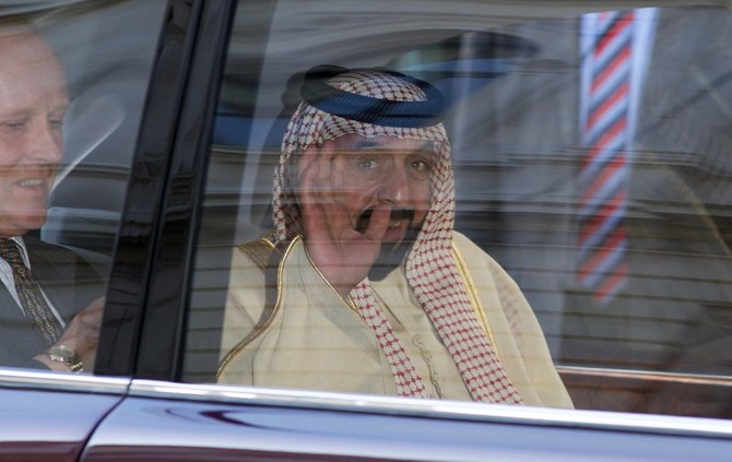 In this file photo taken on May 1, 2013, the late Sheikh Khalifa bin Zayed Al Nahyan waves from his vehicle as he leaves 10 Downing Street in Central London. (File/AFP)