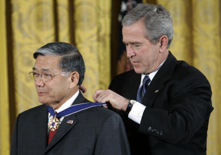 President Bush, right, bestows the Presidential Medal of Freedom to former Transportation Secretary Norman Y. Mineta during a ceremony in the East Room of the White House in Washington, Friday, Dec. 15, 2006. Mineta died Tuesday, May 3, 2022. He was 90. (AP)