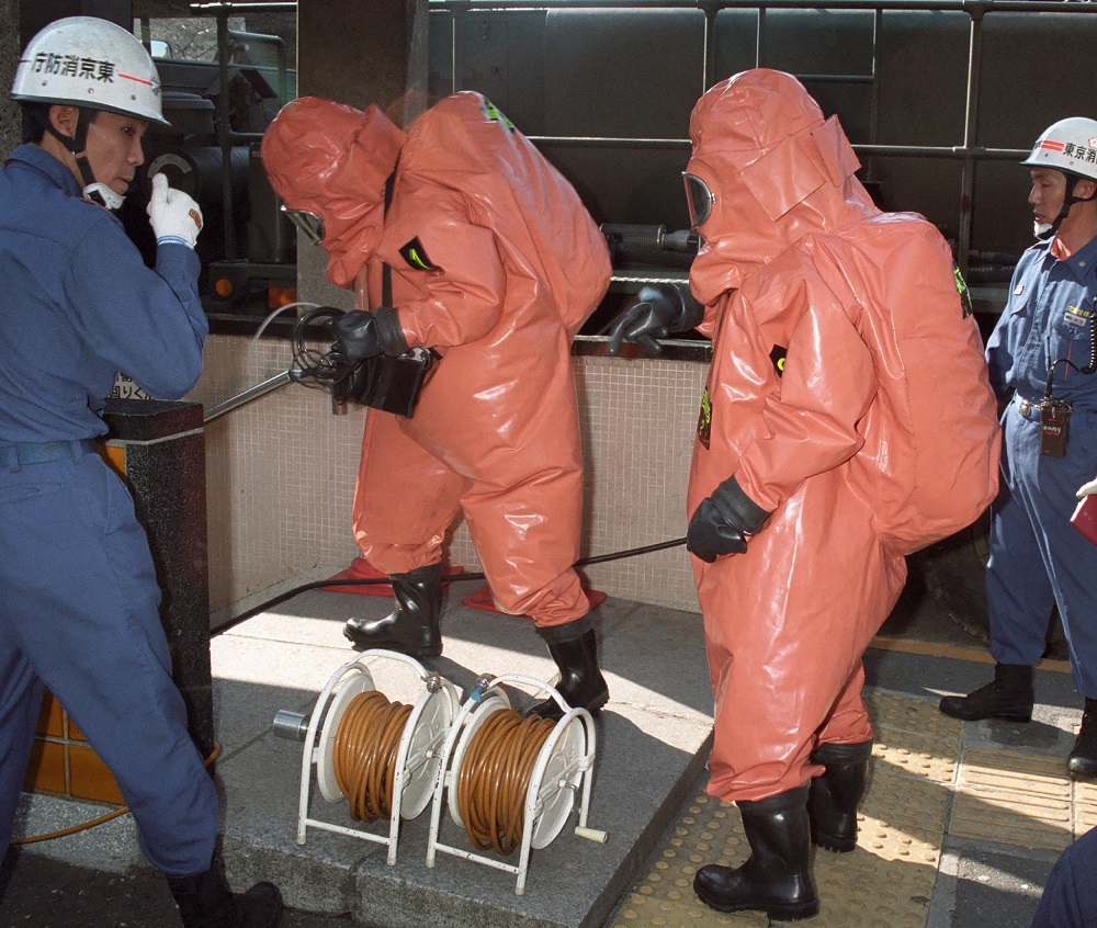 This picture taken on March 20, 1995 shows fire department officers moving into Kasumigaseki subway station following a sarin gas attack by doomsday cult Aum Supreme Truth (Aum Shinrikyo) in Tokyo. (AFP)