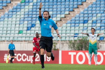 In this file photo taken on May 15, 2019, Japanese referee Yoshimi Yamashita gestures during the AFC Cup football match between Myanmar’s Yangon United and Cambodia's Naga World at the Thuwunna Stadium in Yangon. (AFP)