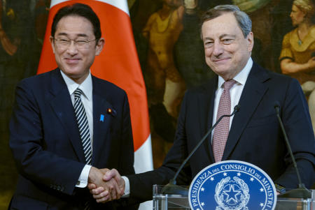 Japanese Prime Minister Fumio Kishida, left, and Italian Premier Mario Draghi shake hands at the end of press point at Chigi Palace government office in Rome, Wednesday, May 4, 2022. Kishida is in Italy and the Vatican, where he met Pope Francis, as part of a six-nation overseas trip. (AP)