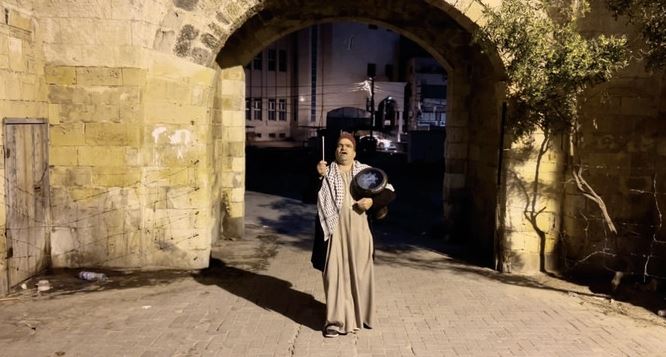 During Ramadan, every day at 2:00 a.m. Nizar Al-Dabbas walks the streets of Gaza beating his drum, singing folkloric songs and chanting poetry. (AN photo)