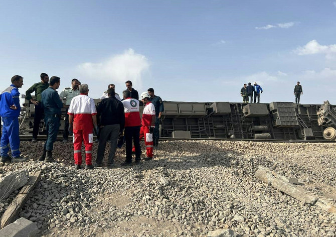 Above, the train derailed after hitting an excavator near the central Iranian city of Tabas, on the line between the cities of Mashhad and Yazd. (Iranian Red Crescent via AFP)