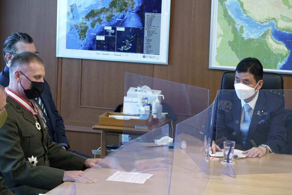 Commander of the U.S. Pacific Marine Corps, Lt. Gen. Steven Rudder, left, meets with Japanese Defense Minister Nobuo Kishi, right, during a courtesy call at the Defense Ministry, June 17, 2022, in Tokyo. (File photo/AP)